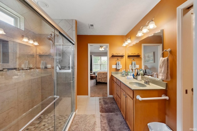 354 Kettle Cir, Lafayette, IN 47905 - ensuite bathroom with double vanity, tile patterned floors, a stall shower, and baseboards