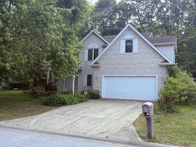 53172 Bracken Fern Dr, South Bend, IN 46637 - traditional-style house featuring stone siding, driveway, a garage, and a front yard