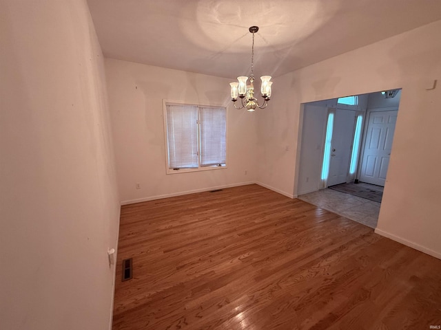 53172 Bracken Fern Dr, South Bend, IN 46637 - entryway with a chandelier, wood finished floors, and baseboards