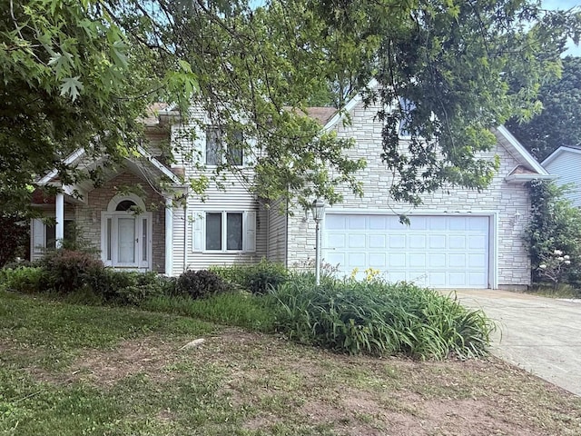 53172 Bracken Fern Dr, South Bend, IN 46637 - obstructed view of property with driveway, a garage, and stone siding