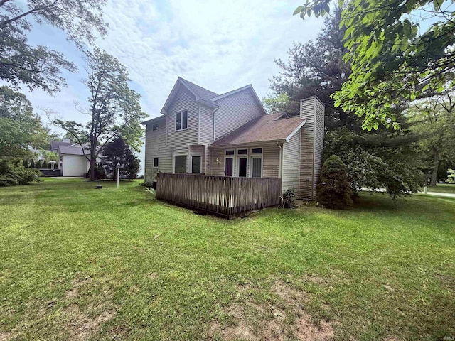 53172 Bracken Fern Dr, South Bend, IN 46637 - rear view of house featuring a chimney, a lawn, and a deck