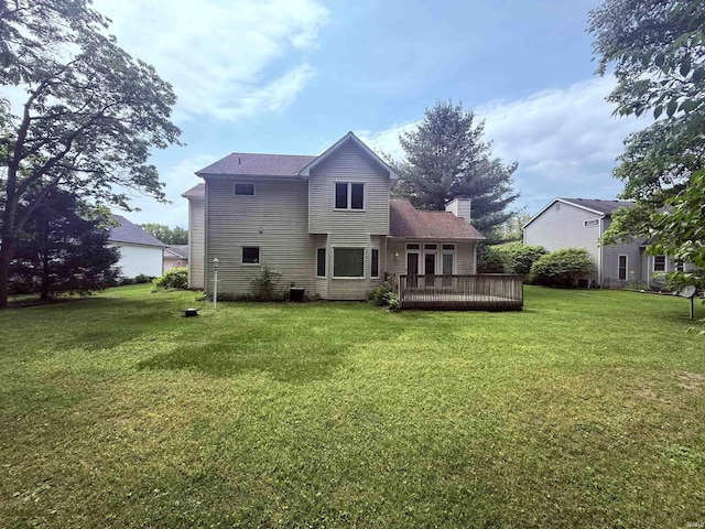 53172 Bracken Fern Dr, South Bend, IN 46637 - back of house with a lawn, a deck, and a chimney