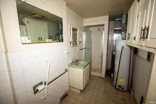 401 S Plymouth St, Culver, IN 46511 - full bath with tile walls, gas water heater, a shower stall, vanity, and a wainscoted wall