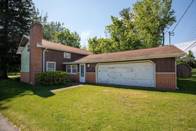 401 S Plymouth St, Culver, IN 46511 - tri-level home with a chimney, brick siding, a front yard, a garage, and board and batten siding