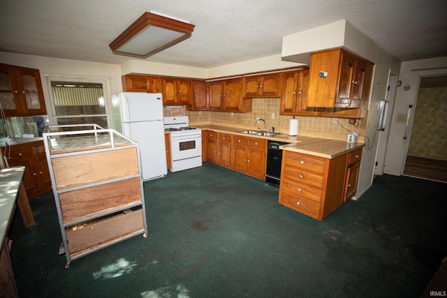 401 S Plymouth St, Culver, IN 46511 - kitchen with white appliances, brown cabinets, a sink, and dark colored carpet