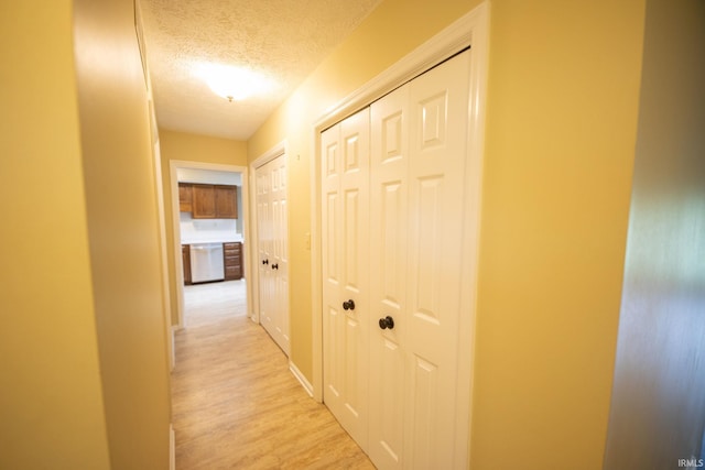 604 W Soutar Dr, Bloomington, IN 47403 - hall with a textured ceiling and light wood finished floors