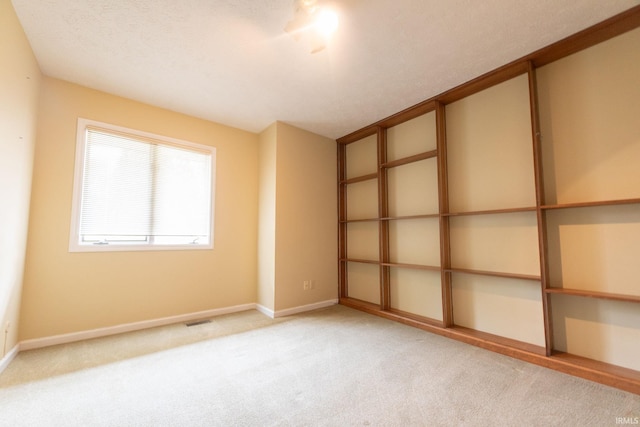 604 W Soutar Dr, Bloomington, IN 47403 - carpeted spare room with baseboards