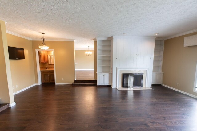 604 W Soutar Dr, Bloomington, IN 47403 - unfurnished living room featuring a textured ceiling, baseboards, dark wood finished floors, built in features, and ornamental molding