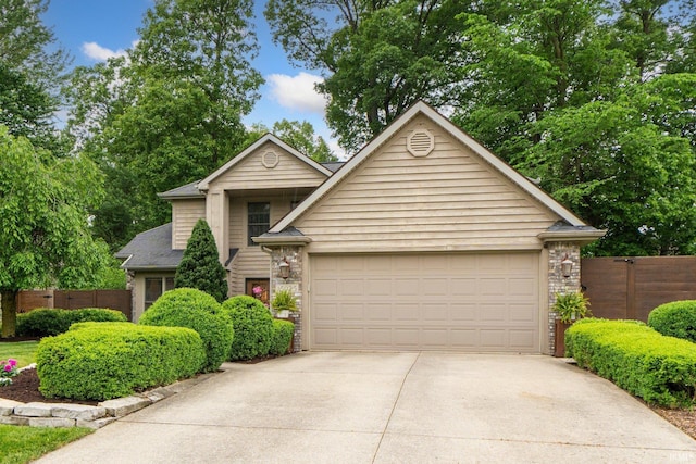 15025 Water Oak Pl, Huntertown, IN 46748 - view of front of house featuring driveway, an attached garage, and brick siding