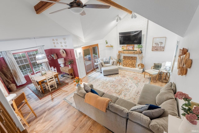 15025 Water Oak Pl, Huntertown, IN 46748 - living room with wood finished floors, beam ceiling, ceiling fan, high vaulted ceiling, and a large fireplace