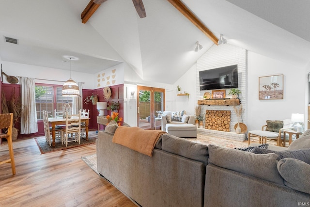 15025 Water Oak Pl, Huntertown, IN 46748 - living area with light wood-style floors, a large fireplace, and a ceiling fan