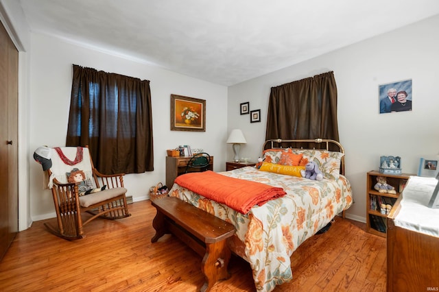 3106 W Brook Dr, Muncie, IN 47304 - bedroom with light wood-style floors, a closet, and baseboards