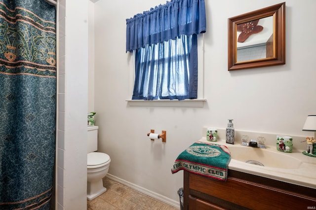 3106 W Brook Dr, Muncie, IN 47304 - bathroom featuring vanity, toilet, baseboards, and a shower with shower curtain