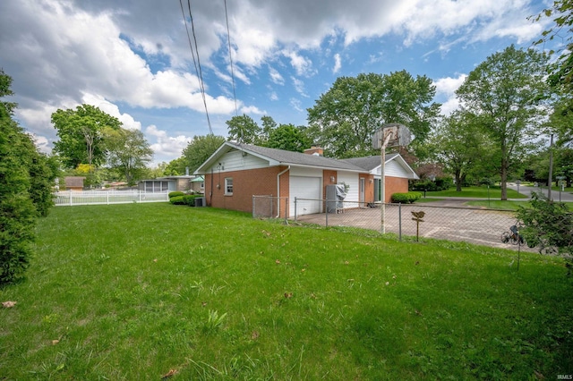 3106 W Brook Dr, Muncie, IN 47304 - view of yard with an attached garage