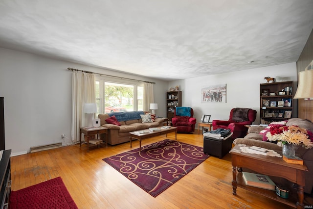 3106 W Brook Dr, Muncie, IN 47304 - living room with a baseboard radiator and hardwood / wood-style floors