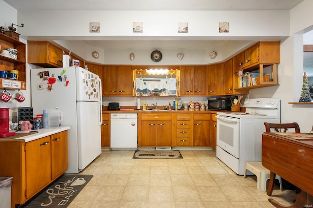 3106 W Brook Dr, Muncie, IN 47304 - kitchen featuring white appliances, open shelves, and brown cabinets
