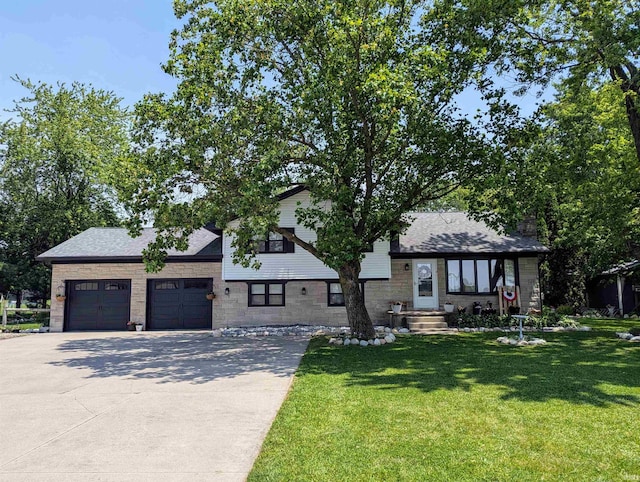 1406 N 800 E, Greentown, IN 46936 - view of front of property featuring concrete driveway, a garage, a front yard, and a shingled roof