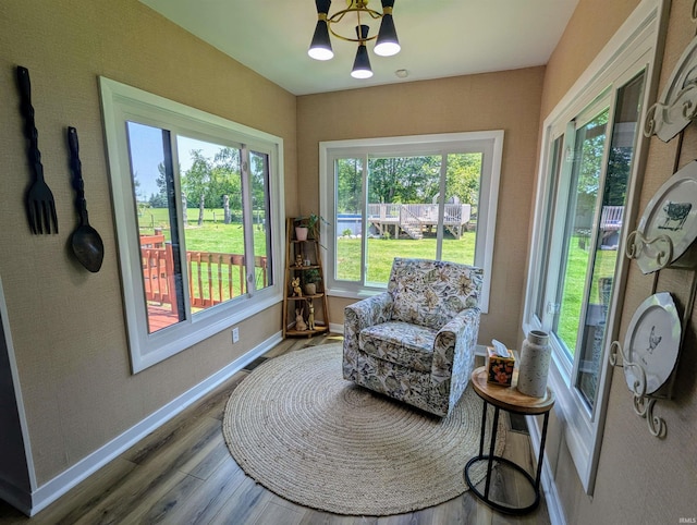 1406 N 800 E, Greentown, IN 46936 - sunroom / solarium featuring wood finished floors, a chandelier, and baseboards