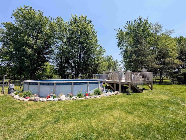 1406 N 800 E, Greentown, IN 46936 - outdoor pool featuring a wooden deck and a lawn