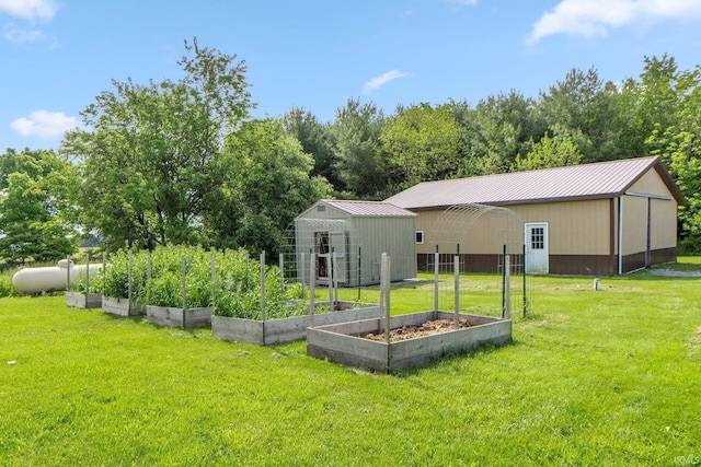 2395 State Road 427th Hwy, Waterloo, IN 46793 - rear view of house with a vegetable garden, an outbuilding, a yard, and metal roof