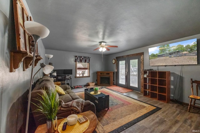 2526 S Airport Rd, Monticello, IN 47960 - living area featuring wood finished floors, ceiling fan, french doors, and baseboards