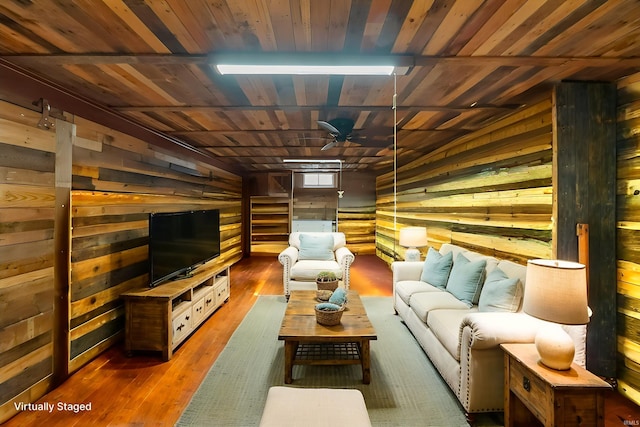 2526 S Airport Rd, Monticello, IN 47960 - living area with wood walls, a ceiling fan, wood finished floors, and wooden ceiling