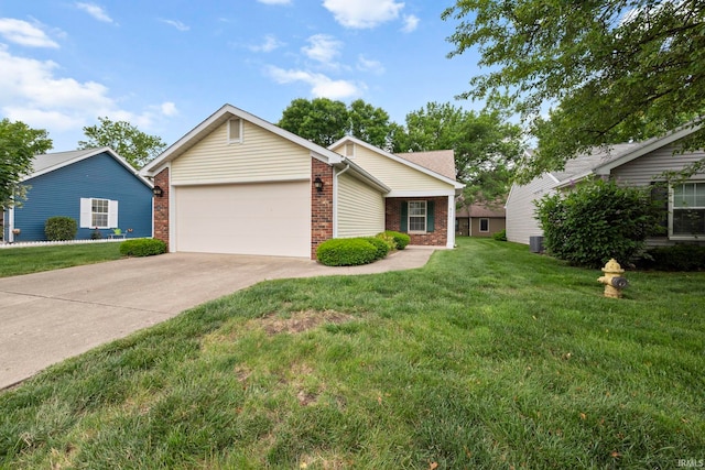 511 Westview Cir, West Lafayette, IN 47906 - view of front of home featuring brick siding, an attached garage, driveway, and a front yard