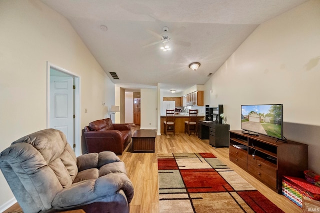 511 Westview Cir, West Lafayette, IN 47906 - living area featuring light wood-style floors, vaulted ceiling, and ceiling fan