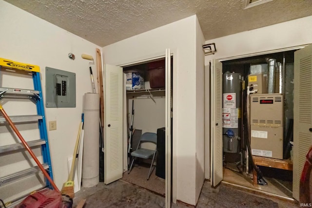 511 Westview Cir, West Lafayette, IN 47906 - bedroom with electric panel, water heater, a closet, heating unit, and a textured ceiling