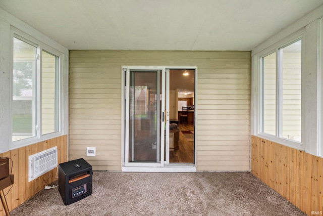 511 Westview Cir, West Lafayette, IN 47906 - unfurnished sunroom featuring wooden walls, carpet floors, and a wall mounted air conditioner