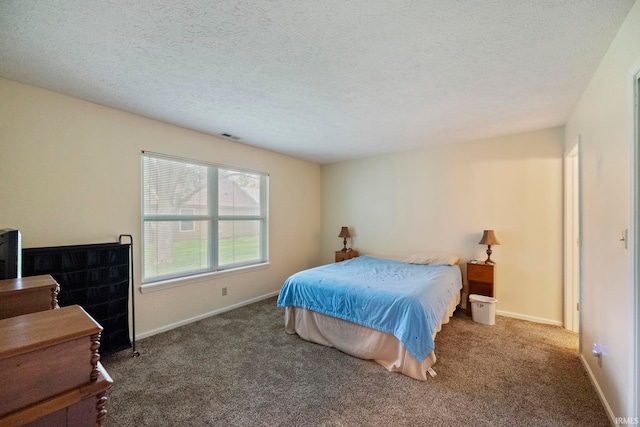511 Westview Cir, West Lafayette, IN 47906 - carpeted bedroom with a textured ceiling and baseboards