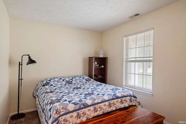 511 Westview Cir, West Lafayette, IN 47906 - bedroom with baseboards, carpet flooring, and a textured ceiling