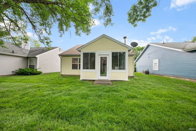 511 Westview Cir, West Lafayette, IN 47906 - back of house with a yard, a sunroom, and central AC