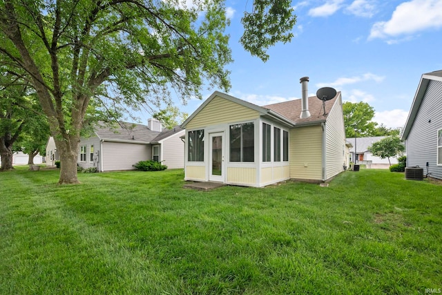511 Westview Cir, West Lafayette, IN 47906 - back of house with central air condition unit, a yard, a sunroom, and roof with shingles