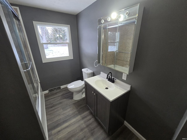 2914 Marian Ave, Lafayette, IN 47905 - full bathroom with a shower with door, toilet, wood finished floors, vanity, and baseboards