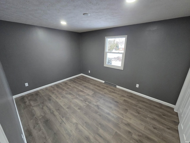 2914 Marian Ave, Lafayette, IN 47905 - unfurnished room featuring wood finished floors, baseboards, a textured ceiling, and recessed lighting