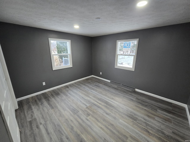 2914 Marian Ave, Lafayette, IN 47905 - spare room featuring recessed lighting, baseboards, wood finished floors, and a textured ceiling