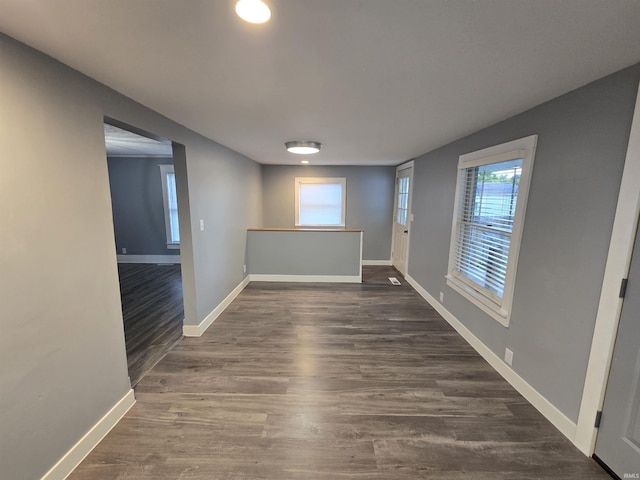 900 S 28th St, Lafayette, IN 47904 - unfurnished room with plenty of natural light, baseboards, and dark wood-style floors