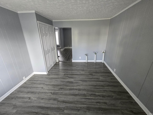 900 S 28th St, Lafayette, IN 47904 - unfurnished room featuring dark wood-type flooring, a textured ceiling, ornamental molding, and baseboards