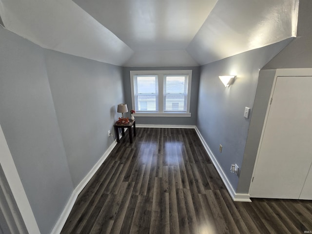 900 S 28th St, Lafayette, IN 47904 - bonus room featuring dark wood finished floors, vaulted ceiling, and baseboards