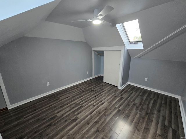 900 S 28th St, Lafayette, IN 47904 - additional living space featuring a skylight, lofted ceiling, dark wood finished floors, ceiling fan, and baseboards