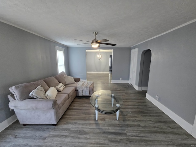 900 S 28th St, Lafayette, IN 47904 - living room with ceiling fan, a textured ceiling, arched walkways, baseboards, and ornamental molding