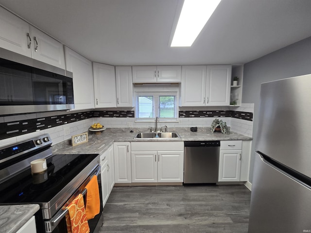 900 S 28th St, Lafayette, IN 47904 - kitchen featuring stainless steel appliances, a sink, dark wood-type flooring, and white cabinetry