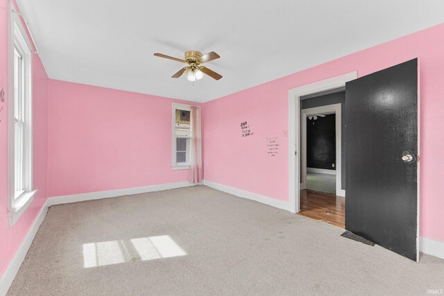 3422 S Calhoun St, Fort Wayne, IN 46807 - carpeted empty room featuring ceiling fan and baseboards