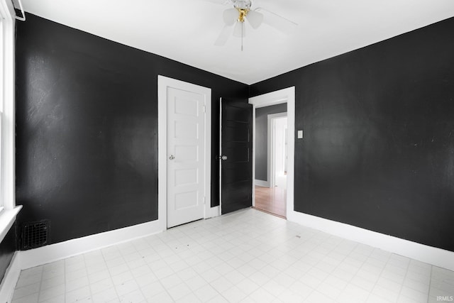 3422 S Calhoun St, Fort Wayne, IN 46807 - empty room with a ceiling fan and baseboards