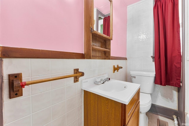 3422 S Calhoun St, Fort Wayne, IN 46807 - half bathroom with toilet, vanity, and tile walls