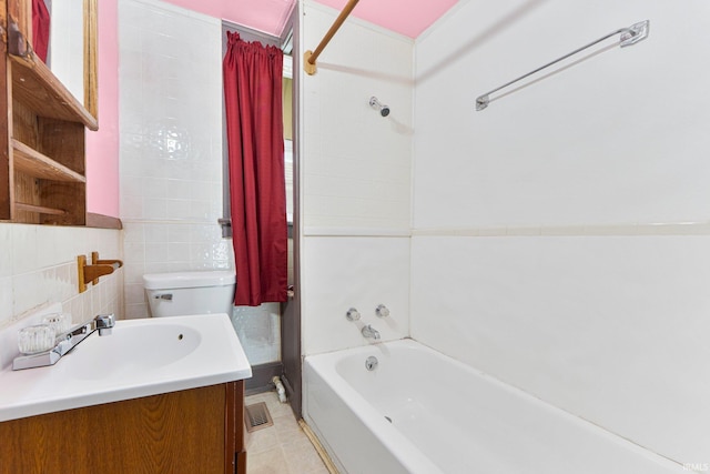 3422 S Calhoun St, Fort Wayne, IN 46807 - bathroom with shower / tub combo with curtain, vanity, toilet, tile walls, and tile patterned flooring