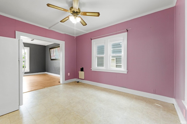 3422 S Calhoun St, Fort Wayne, IN 46807 - empty room featuring ceiling fan, baseboards, and ornamental molding