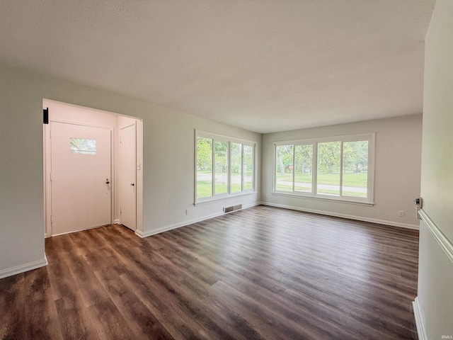 2425 Ojibway Trl, Fort Wayne, IN 46809 - foyer with healthy amount of natural light, dark wood finished floors, and baseboards