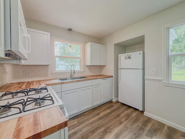 2425 Ojibway Trl, Fort Wayne, IN 46809 - kitchen featuring wooden counters, white appliances, a sink, and decorative backsplash